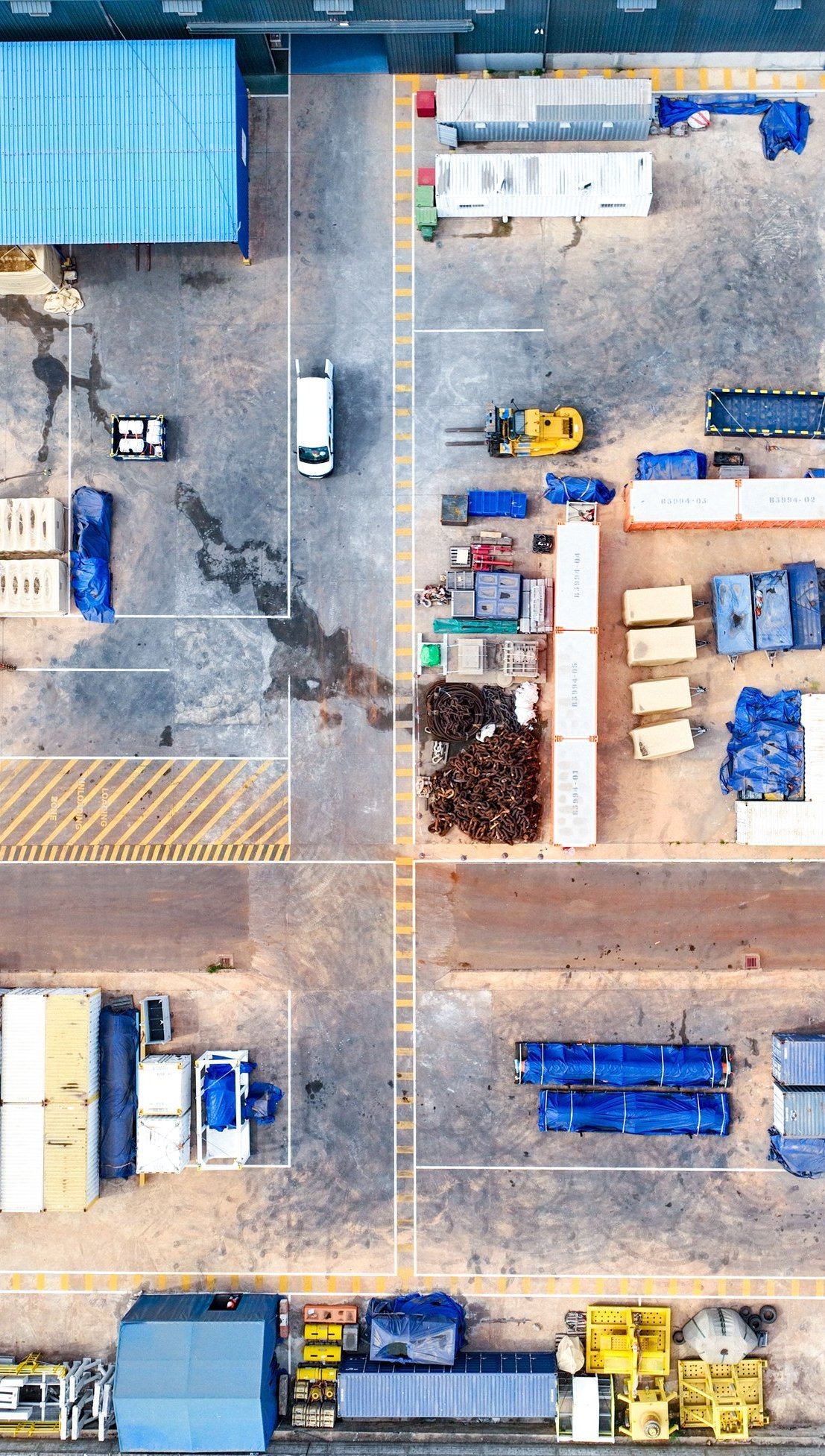 Overhead view of the SILS yard showing marked circulation routes and staged materials