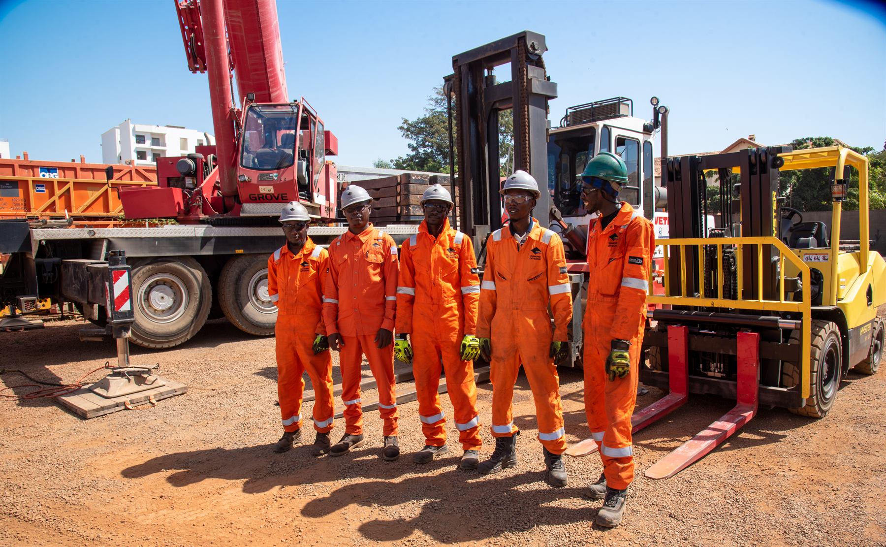 The SILS crew in orange PPE at the Bel Air base